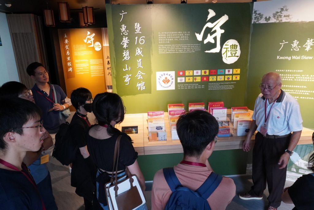 Mr Kwan (first from right) beginning the guided tour of the heritage gallery at Kwong Wai Siew Peck San Theng.