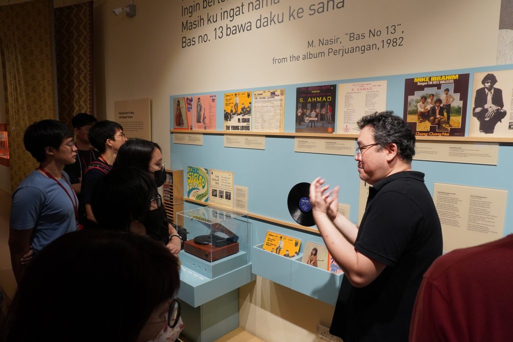 Dr Ho sharing aspects of the curating process with students. Dr Ho was heavily involved in the curation and setting up of Geylang Serai Heritage Gallery.