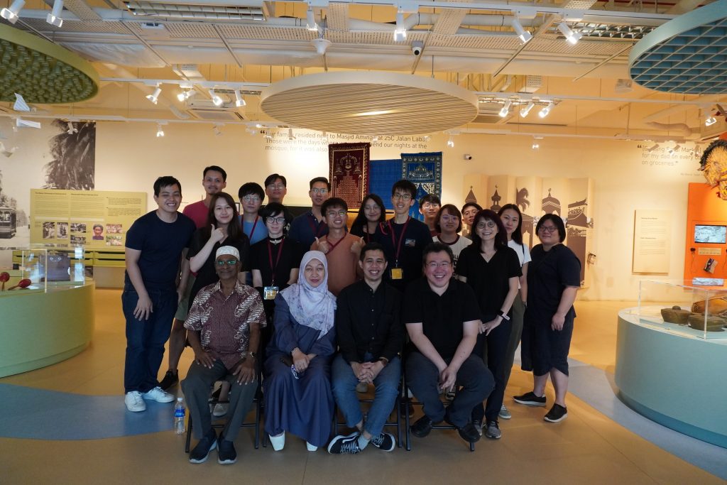 Group photo at the Geylang Serai Heritage Gallery with former Geylang Serai residents, Mr Shaik Kadir (seated, first from left) and Mdm Rosni Hassin (seated, second from left), and Mr Sufiyan Hanafi (seated, second from right), formerly of the Malay Heritage Centre’s curatorial team.