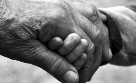 grandparent holdng hands with child